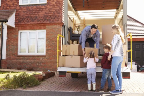 Professional movers handling furniture during a Deptford relocation