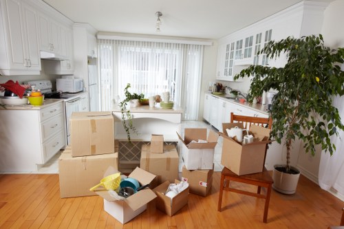 Separated waste containers for cardboard, plastics, and mixed recyclables